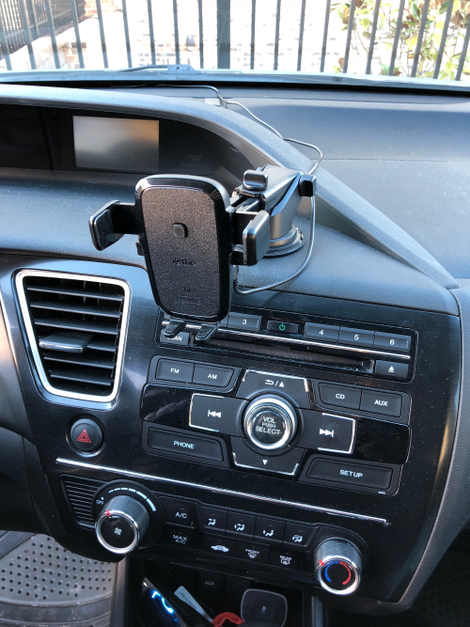 I ran an extra long microUSB cable from my car charger (at the bottom of the photo) under the steering column, up the driver door’s weather seal, and under the windshield, and now I don’t have a cable hanging out in front of my dashboard buttons. This is the best reason to buy this product.